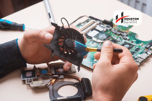 Gadget Maintenance Tips Make Your Devices Last Longer - cleaning a fan from a laptop during a maintenance session.